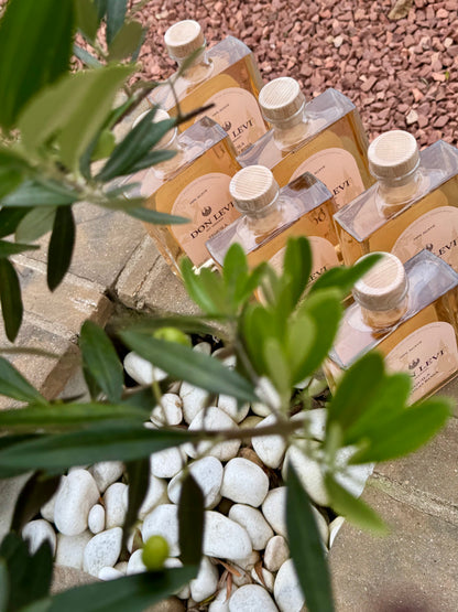 6 bottles of Don Levi Rosa underneath a olive tree
